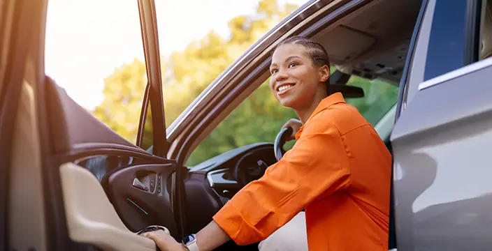 Woman exiting car