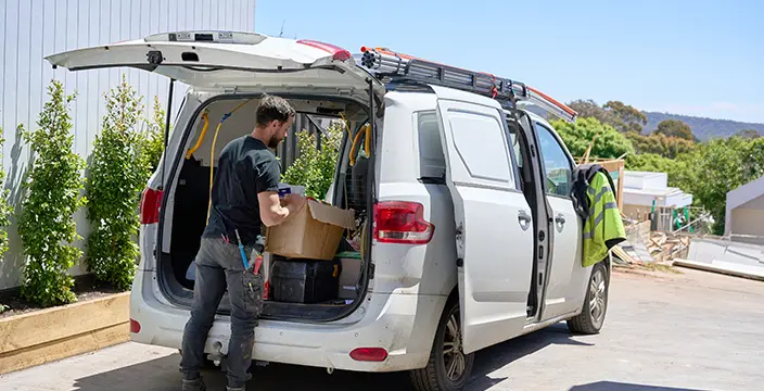 Worker packing van