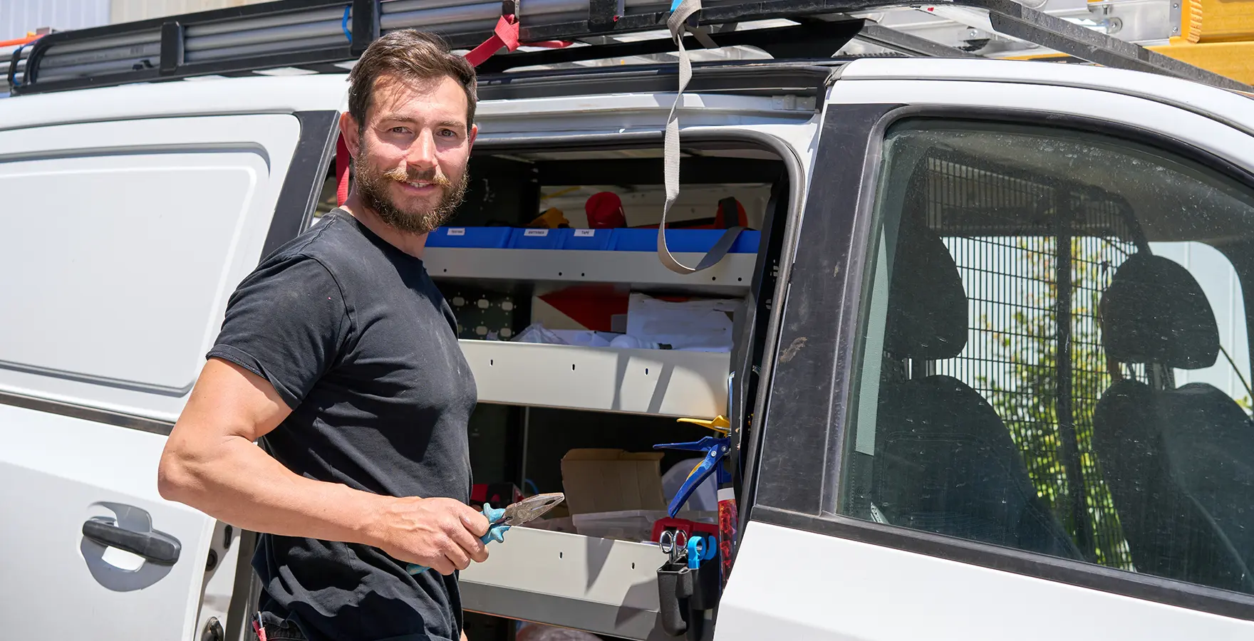 Worker standing by truck