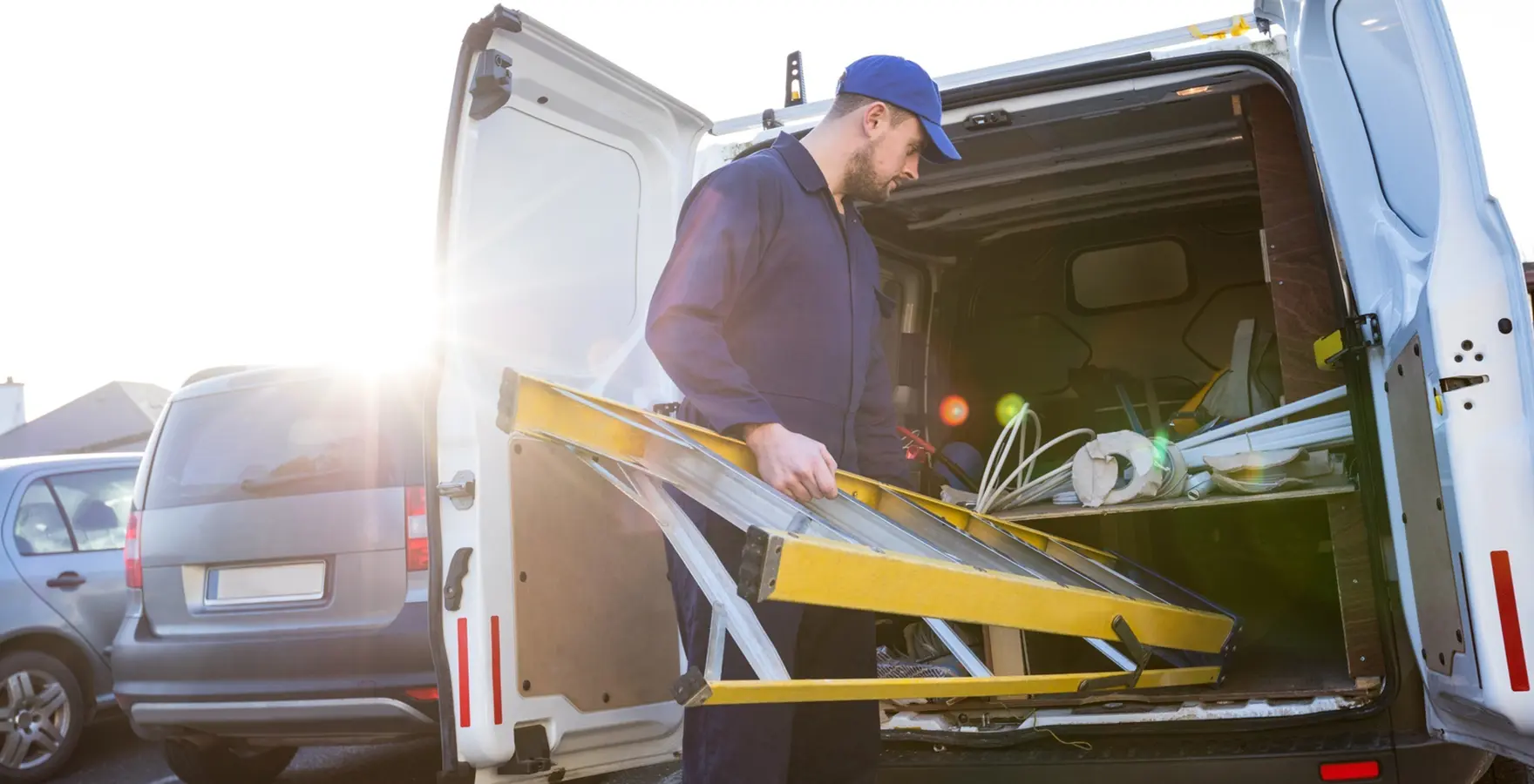 Worker unpacking van