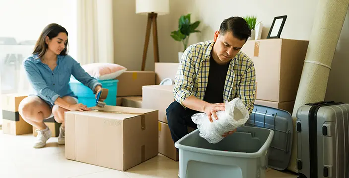 Couple unpacking boxes