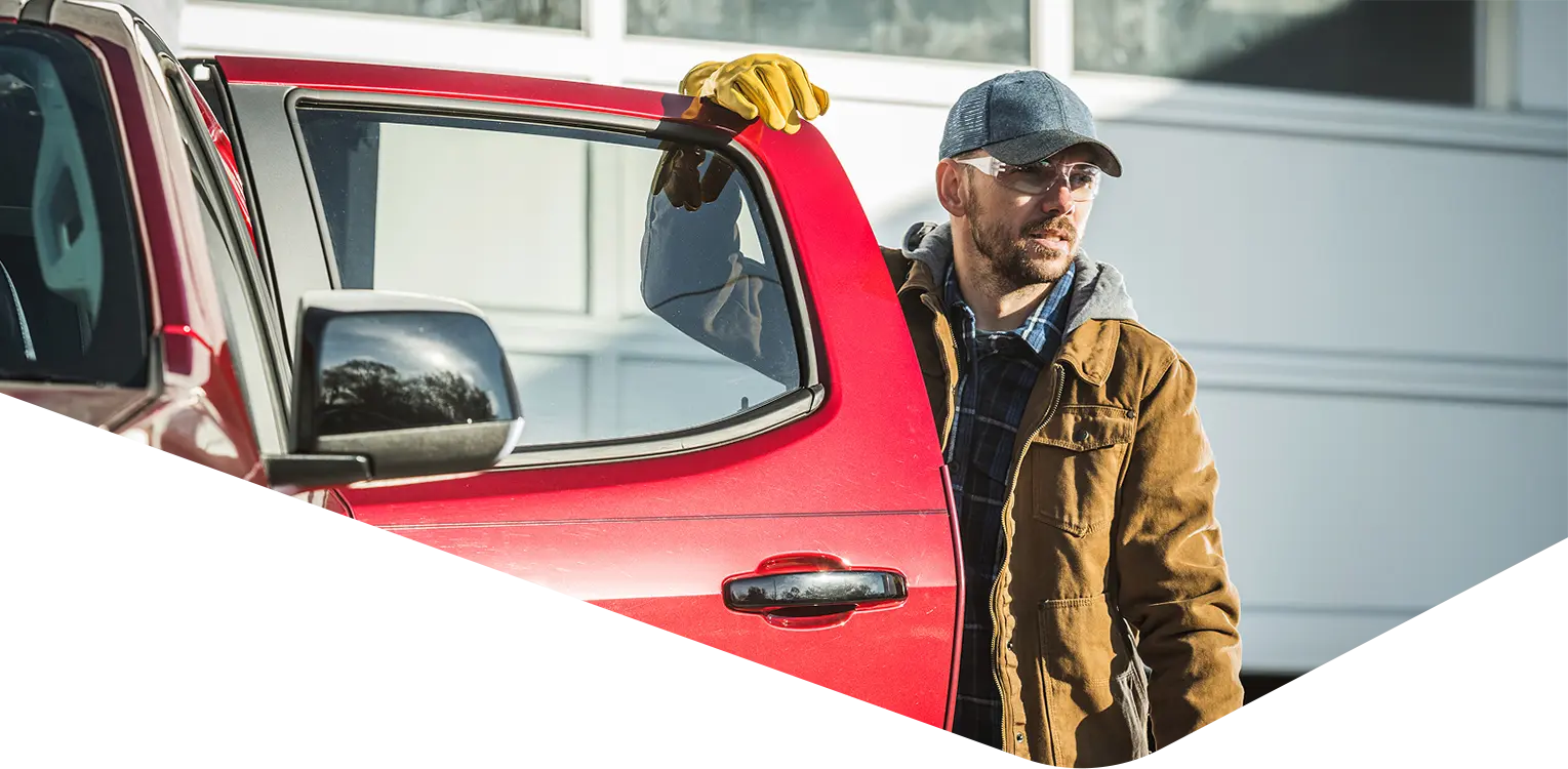 Man standing by a truck