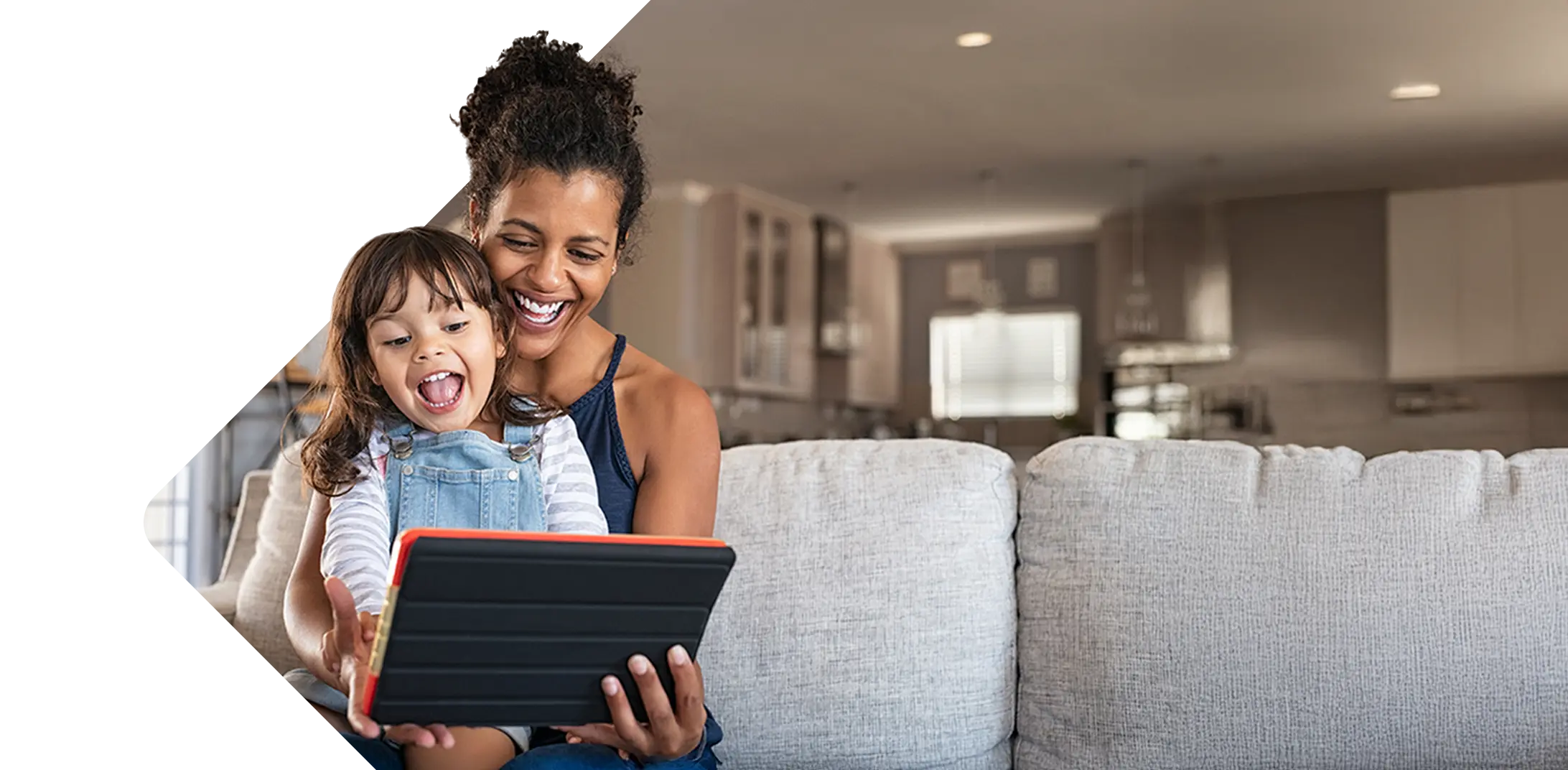 Woman and child looking at a mobile device