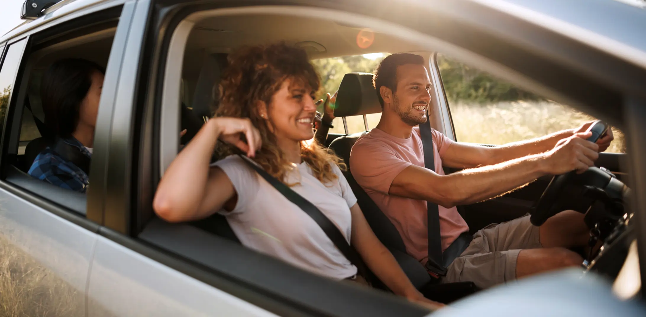 Couple driving in car