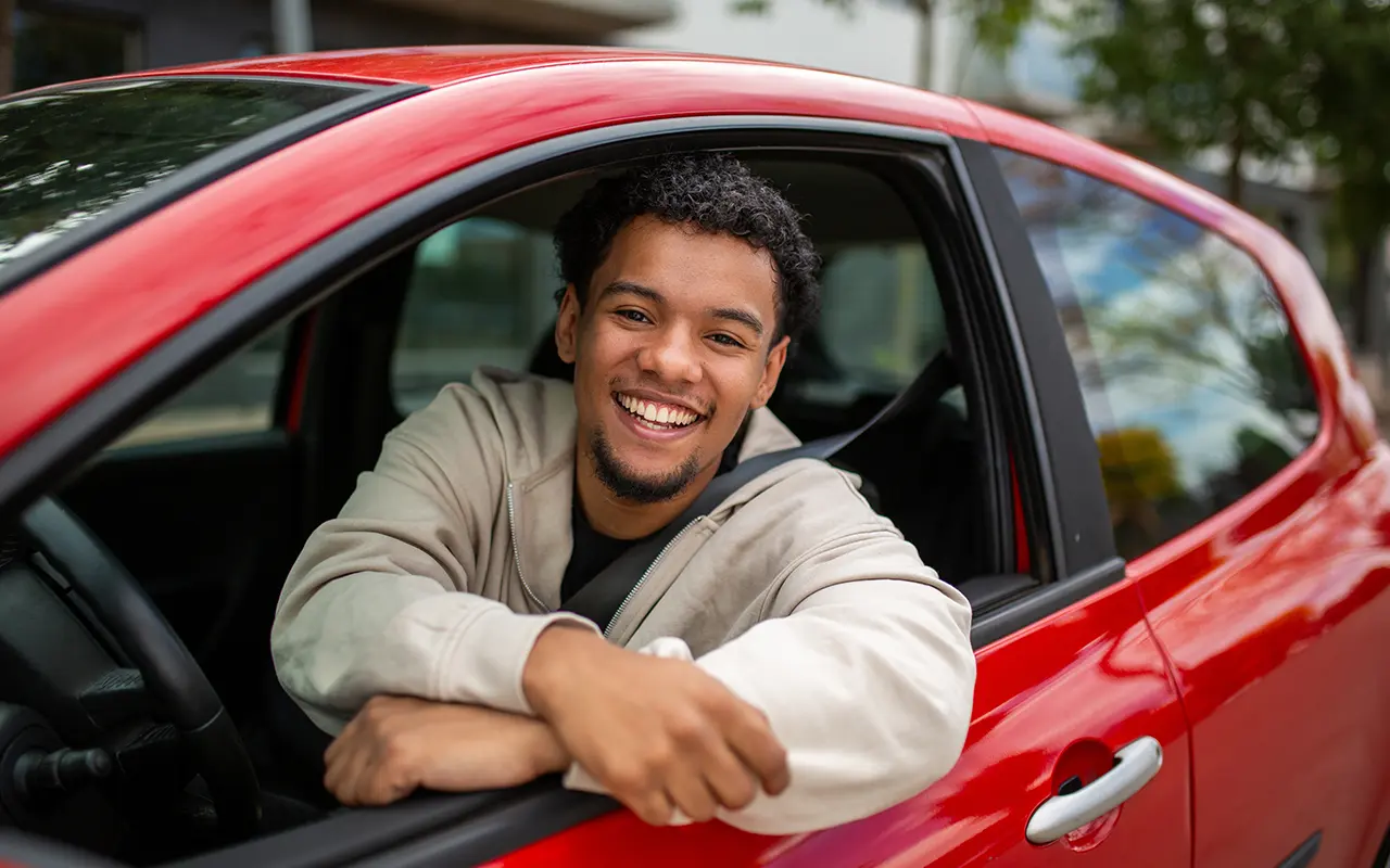 Man leaning out of car