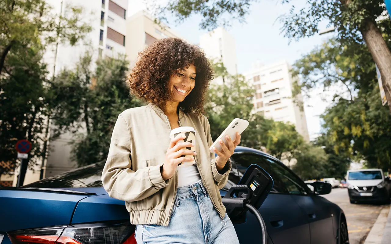 Woman standing by car