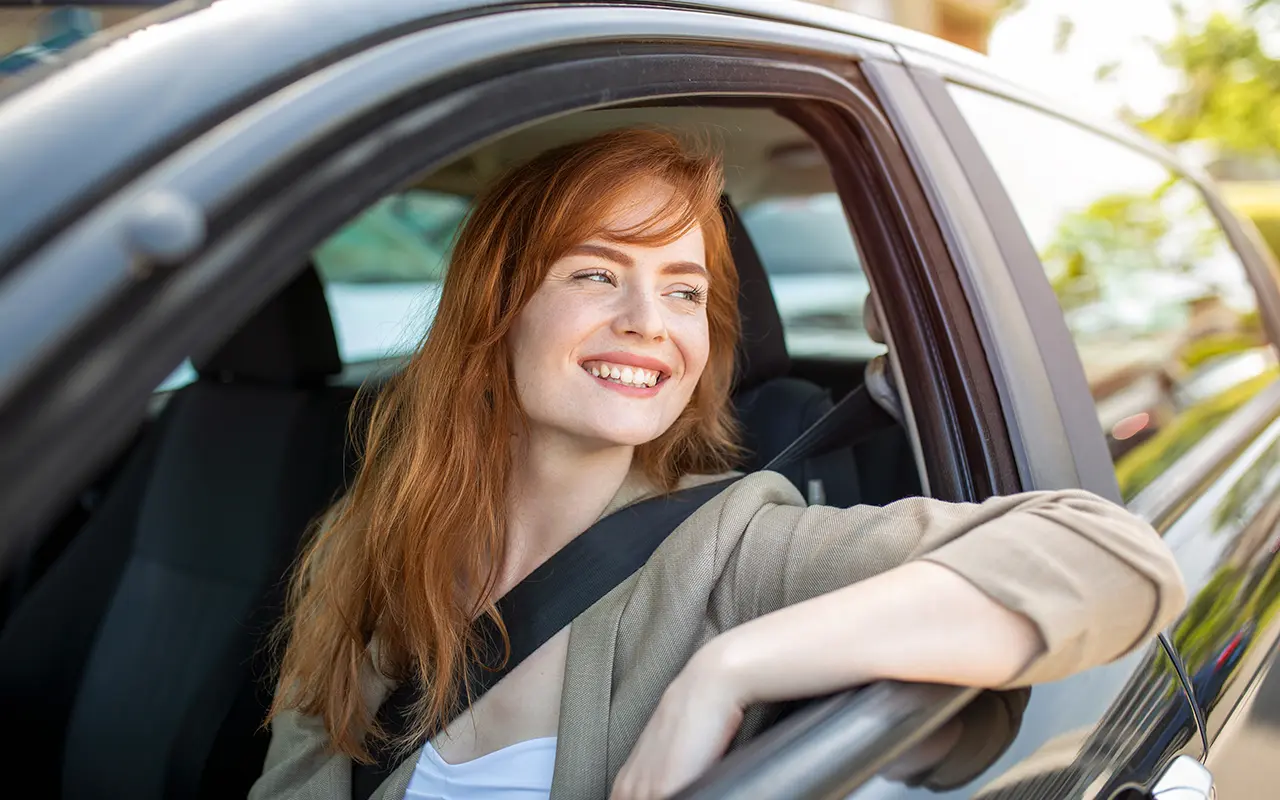 Woman looking out of car window